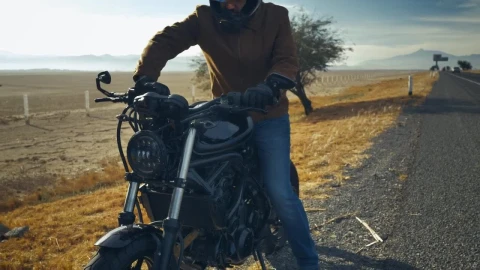 Stock Video Man Riding His Motorcycle On The Side Of A Roa Animated Wallpaper - Free Live Wallpaper