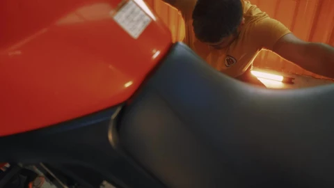 Stock Video Man Repairing His Motorcycle In A Garag Animated Wallpaper - Free Live Wallpaper