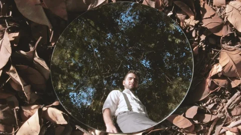 Stock Video Man Reflected In A Mirror On Dry Leave Animated Wallpaper - Free Live Wallpaper