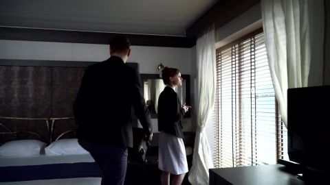 Stock Video Man Puts Luggage On Bed And Looks Out Window O Animated Wallpaper - Free Live Wallpaper