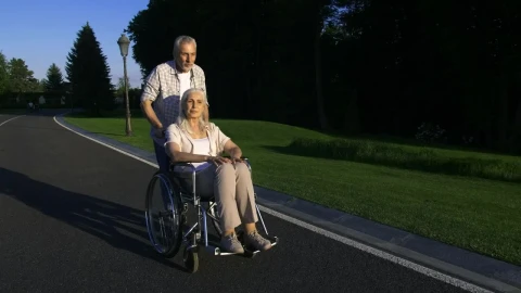 Stock Video Man Pushing His Wife In Her Wheelchai Animated Wallpaper - Free Live Wallpaper
