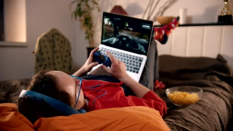 Stock Video Man Playing Video Games Lying In His Roo Animated Wallpaper - Free Live Wallpaper