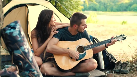 Stock Video Man Playing Guitar To His Girlfriend In Cam Animated Wallpaper - Free Live Wallpaper