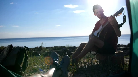 Stock Video Man Playing A Guitar While Campin Animated Wallpaper - Free Live Wallpaper