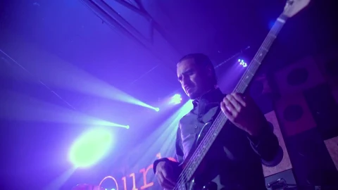 Stock Video Man Playing A Bass Guitar On A Stag Animated Wallpaper - Free Live Wallpaper