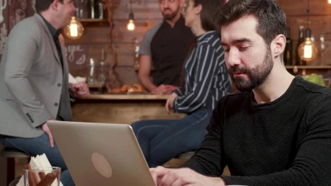 Stock Video Man Pauses To Think While Typing On Laptop In Caf Animated Wallpaper - Free Live Wallpaper