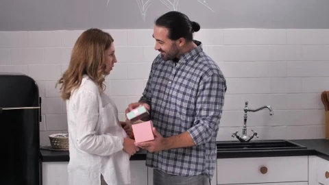 Stock Video Man Opening A Gift From His Wif Animated Wallpaper - Free Live Wallpaper