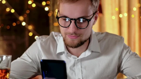 Stock Video Man On Mobile Phone With Whisky And Bokeh Light Animated Wallpaper - Free Live Wallpaper