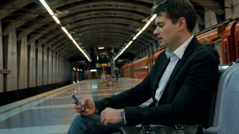 Stock Video Man On His Phone Waiting For A Trai Animated Wallpaper - Free Live Wallpaper