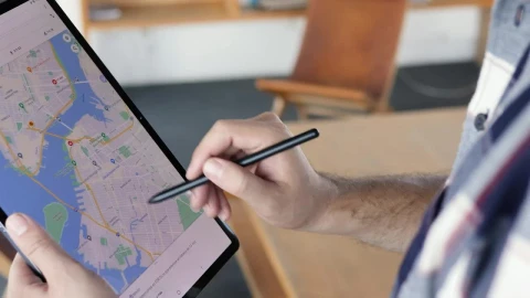Stock Video Man Locating An Area On A Map On A Table Animated Wallpaper - Free Live Wallpaper