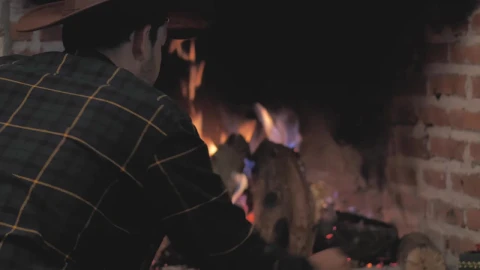 Stock Video Man Lighting Fireplace With Firewoo Animated Wallpaper - Free Live Wallpaper