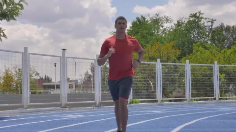 Stock Video Man Jogging On A Running Track On A Sunny Da Animated Wallpaper - Free Live Wallpaper