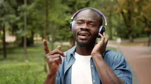 Stock Video Man Inspired By Music In Headphones Sings Alon Animated Wallpaper - Free Live Wallpaper