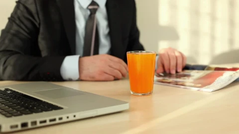 Stock Video Man In Suit Flipping Through A Magazin Animated Wallpaper - Free Live Wallpaper