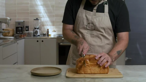 pastry chef cutting a loaf into slices 43015 - Free Live Wallpaper