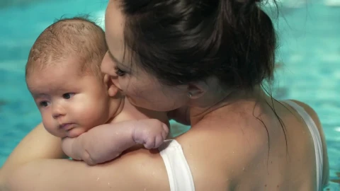 Stock Video Mother With Her Little Baby In A Swimming Pool Live Wallpaper - Free Live Wallpaper