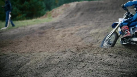 Stock Video Motocross Racer Moving Up A Dirt Hill Live Wallpaper - Free Live Wallpaper