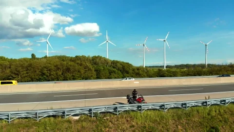 Stock Video Motorcycle On The Highway With A Wind Farm Behind Live Wallpaper - Free Live Wallpaper