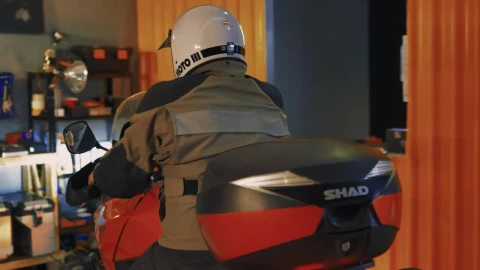 Stock Video Motorcyclist Arriving At A Mechanical Workshop Live Wallpaper - Free Live Wallpaper