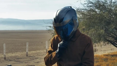 Stock Video Motorcyclist On The Side Of A Road Before Setting Off Live Wallpaper - Free Live Wallpaper