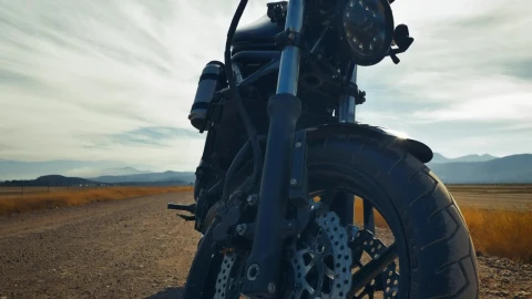 Stock Video Motorcyclist Riding A Motorcycle Parked In A Desert Live Wallpaper - Free Live Wallpaper