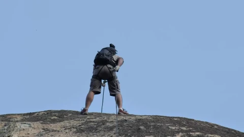 Stock Video Mountaineer Descending A Rocky Slope Live Wallpaper - Free Live Wallpaper