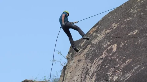 Stock Video Mountaineer Descending From A Rocky Mountain Live Wallpaper - Free Live Wallpaper
