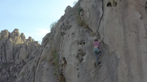Stock Video Mountaineer Girl Climbing A Steep Rocky Mountain Live Wallpaper - Free Live Wallpaper