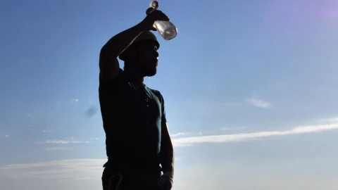 Stock Video Mountaineer Man Cooling Off By Throwing Water On Himself Live Wallpaper - Free Live Wallpaper
