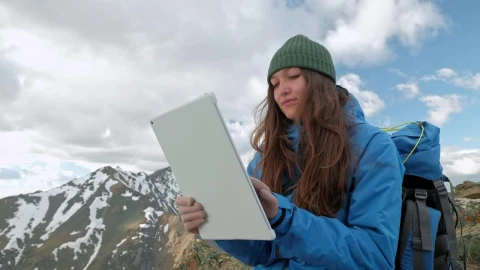Stock Video Mountaineer Using A Tablet On A Mountain Live Wallpaper - Free Live Wallpaper