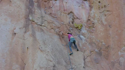 Stock Video Mountaineer Woman Climbing A Huge Mountain Live Wallpaper - Free Live Wallpaper