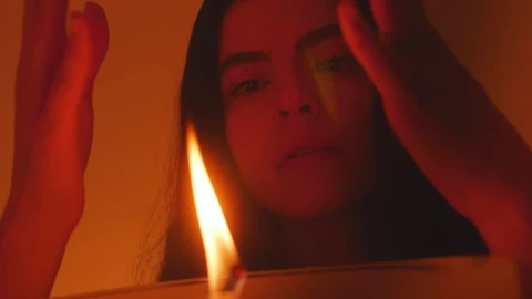 Stock Video Mysterious Woman Appreciating The Flame Of A Candle Live Wallpaper - Free Live Wallpaper