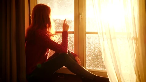 Stock Video Nostalgic Woman Watching The Sunset By The Window Live Wallpaper - Free Live Wallpaper