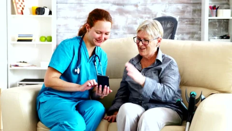 Stock Video Nurse Sitting With A Patient Live Wallpaper - Free Live Wallpaper
