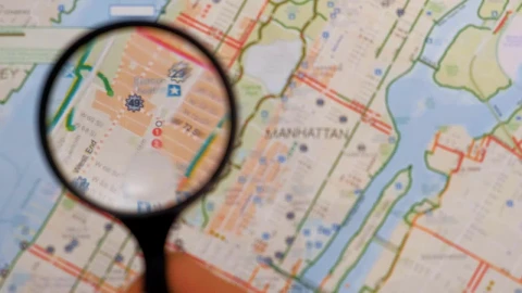 Stock Video Observing With A Magnifying Glass On A Map Of Manhattan Live Wallpaper - Free Live Wallpaper