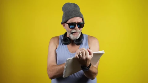 Stock Video Old Man Writing Be Yourself On A Notebook Live Wallpaper - Free Live Wallpaper