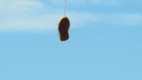 Stock Video Old Shoes Hanging On An Electric Wire Live Wallpaper - Free Live Wallpaper