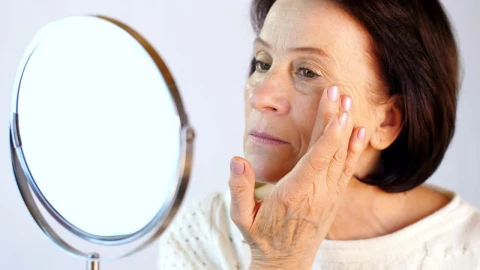 Stock Video Old Woman Happily Looking Her Face In A Mirror Live Wallpaper - Free Live Wallpaper