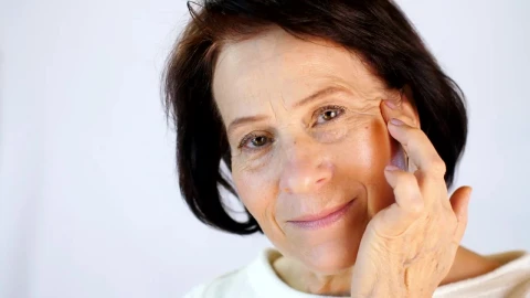 Stock Video Old Woman Massaging Skin On Her Face Live Wallpaper - Free Live Wallpaper