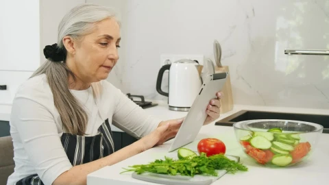 Stock Video Old Woman Searching For Healthy Recipes Live Wallpaper - Free Live Wallpaper
