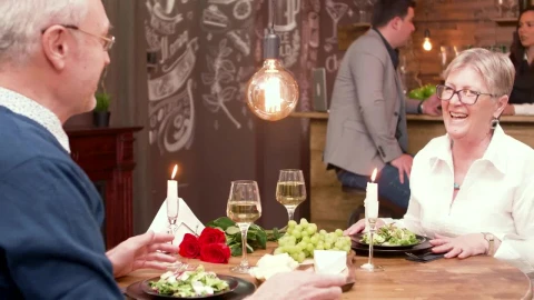 Stock Video Older Man Gives Woman Gift At Romantic Dinner Date Live Wallpaper - Free Live Wallpaper