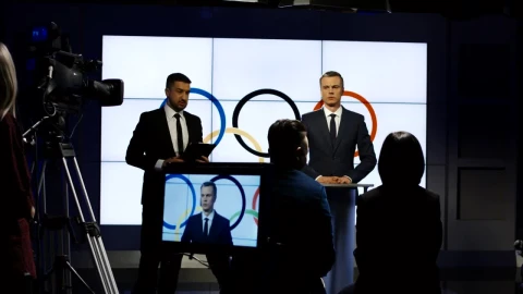 Stock Video Olympics Spokesman On A Television Interview Live Wallpaper - Free Live Wallpaper