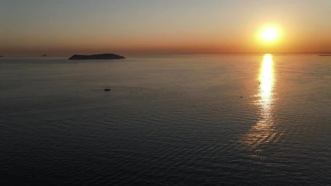 Stock Video Open Sea With A Small Boat In The Sunset Live Wallpaper - Free Live Wallpaper