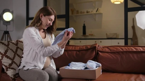 Stock Video Opening A Delivery Of Baby Clothes Live Wallpaper - Free Live Wallpaper