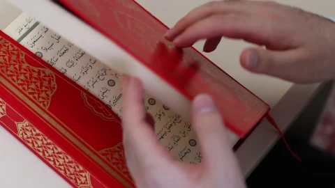 Stock Video Opening A Red Thick Book In Arabic Quran Live Wallpaper - Free Live Wallpaper
