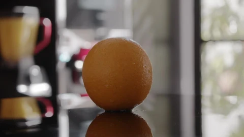 Stock Video Orange Spinning On A Table Live Wallpaper - Free Live Wallpaper