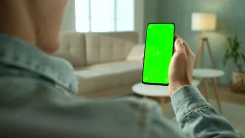 Stock Video Over Shoulder View Of A Man Holding A Green Screen Live Wallpaper - Free Live Wallpaper