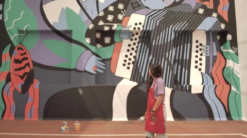Stock Video Paint Covered Woman Stands In Front Of Mural Live Wallpaper - Free Live Wallpaper