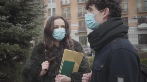 Stock Video Pair Of Boys With Masks Talking On The Street Live Wallpaper - Free Live Wallpaper