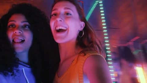 Stock Video Pair Of Female Friends Having Fun On A Night Out Live Wallpaper - Free Live Wallpaper